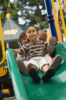 Children sliding in playground