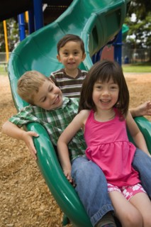 Children sliding in playground
