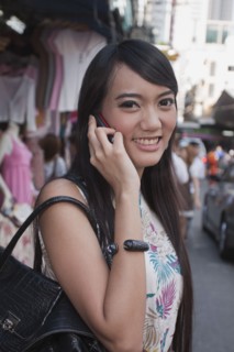 Asian woman talking on cell phone