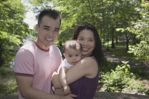 Chinese couple and baby in park