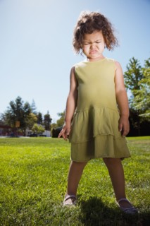 Mixed race girl crying in park