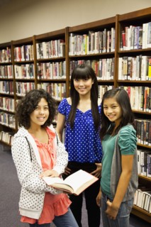 Girls standing in library