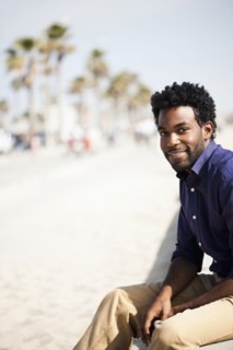 African American man sitting outdoors