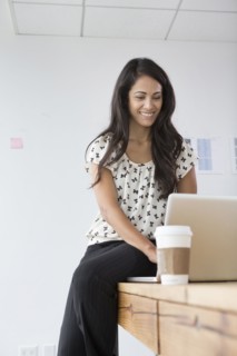 Businesswoman working on laptop in office
