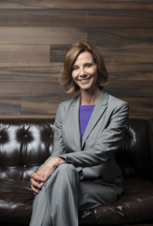 Caucasian businesswoman smiling in office