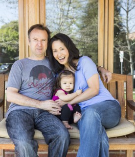 Family relaxing together on porch