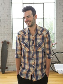Caucasian man smiling in loft