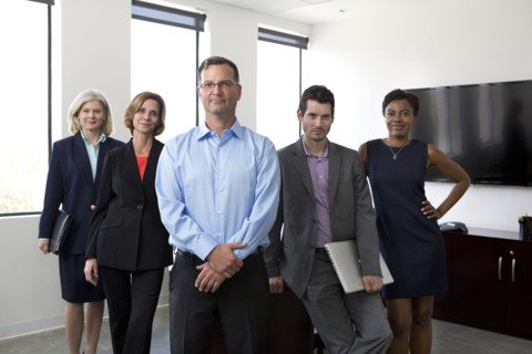 Business people smiling together in office