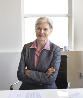 Caucasian businesswoman smiling in office