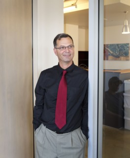 Caucasian businessman smiling in office