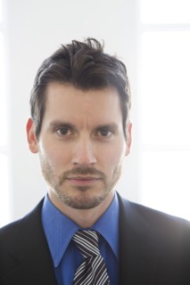 Close up of mixed race businessman's face