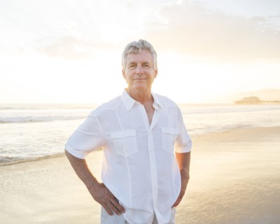 Caucasian man smiling on beach