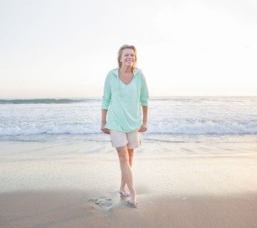 Caucasian woman smiling on beach
