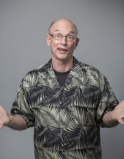 Older Caucasian man shrugging