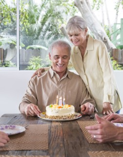 Caucasian family celebrating birthday at table
