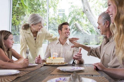 Caucasian family celebrating birthday at table