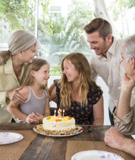 Caucasian family celebrating birthday at table
