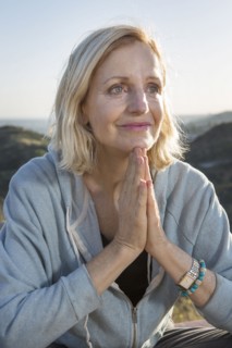Close up of Caucasian woman with hands clasped