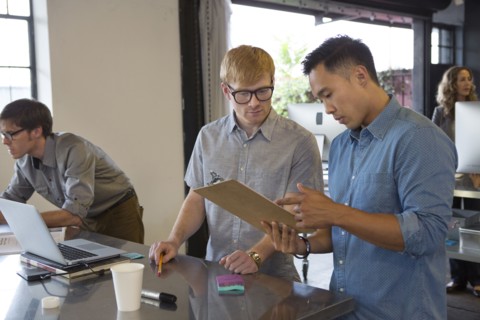 Businessmen talking in office