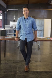 Mixed race businessman smiling in office