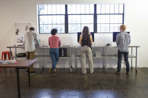 Business people working at desks in office