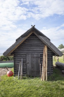 Wood shed under clouds
