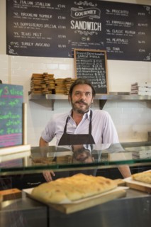 Caucasian server working in cafe