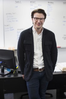 Caucasian businessman smiling in office