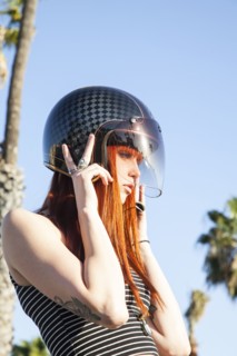 Caucasian woman wearing motorcycle helmet