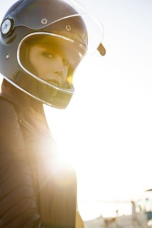 Caucasian woman wearing motorcycle helmet