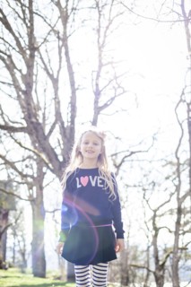 Smiling girl walking in park