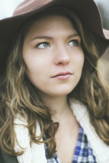 Pensive Caucasian woman wearing sun hat