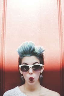Stylish Caucasian woman with sunglasses and dyed hair