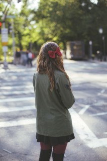 Caucasian woman crossing city intersection