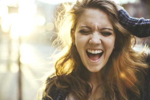 Caucasian woman shouting outdoors