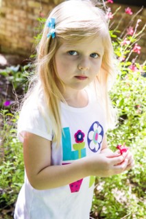Caucasian girl playing in backyard