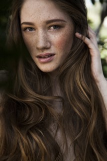 Caucasian woman with long hair and freckles