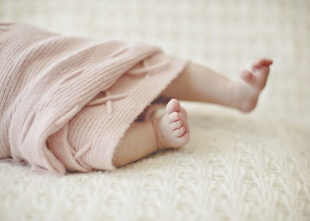 Close up of feet of newborn baby girl