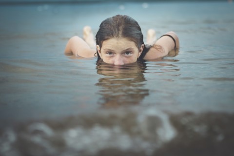 Caucasian girl swimming