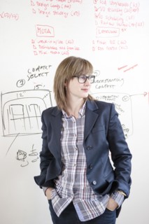 Businesswoman standing at whiteboard in office