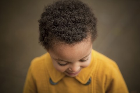 Close up of girl wearing yellow coat