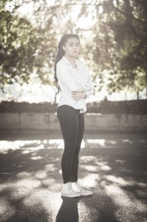 Serious woman standing outdoors