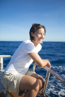 Caucasian woman sitting on boat deck