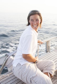 Caucasian woman smiling on boat deck
