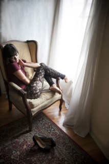 Caucasian woman sitting in armchair