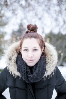 Caucasian teenage girl wearing parka outdoors