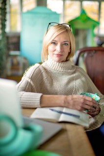 Caucasian entrepreneur drinking cup of coffee in shop