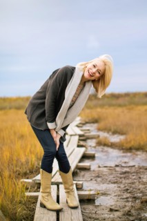 Caucasian woman standing on walkway in rural field