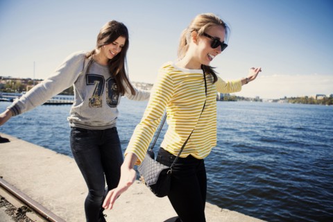 Sisters exploring waterfront