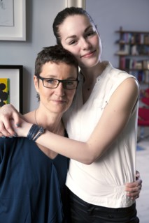 Caucasian mother and daughter hugging